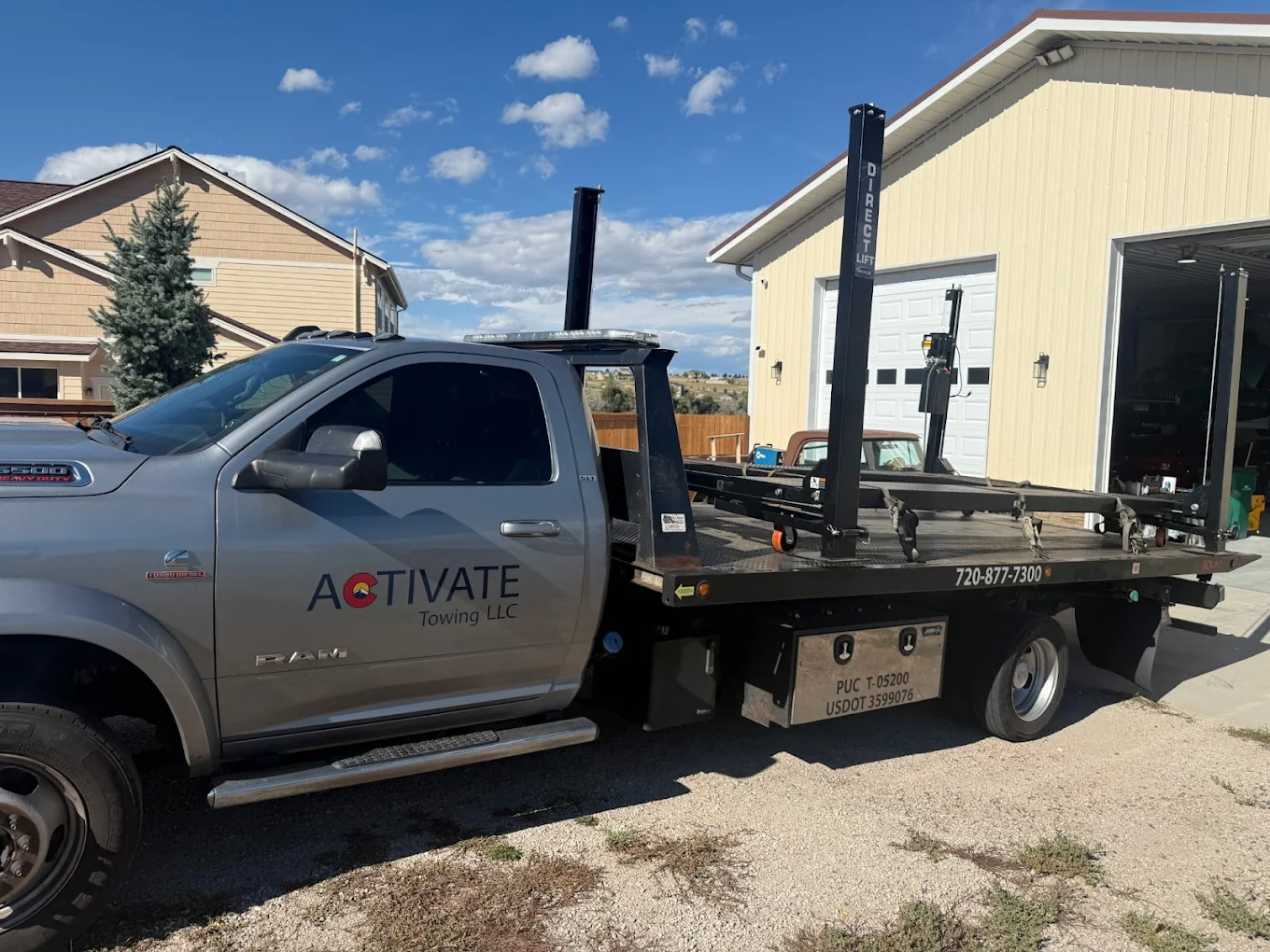 Activate Towing Ram 5500 flatbed tow truck ready for dispatch in Elizabeth, Colorado